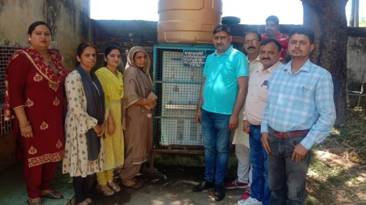 resident of Caiharian presented a water cooler to Tahliyan school