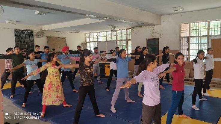 Officers and employees working to make the 8th International Yoga Day a success