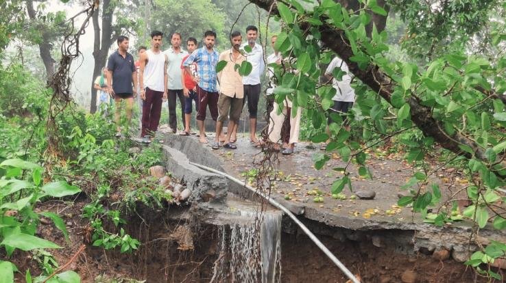 Kangra: Rain water washed away the road leading to Harijan Basti in Nandrul village