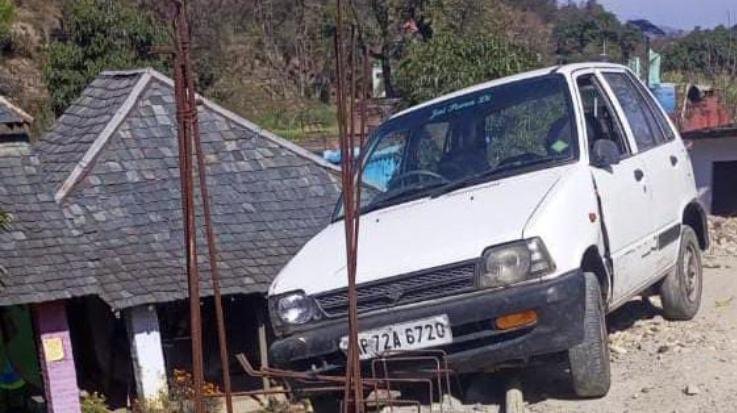 Car hanging on the bridge under construction on Khal Khad in Saleti