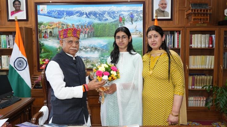 The governor honored Charvi, who was the state topper in NEET
