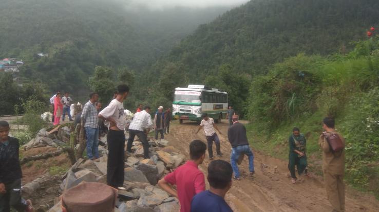 HRTC's Lodia-Ghati bus stuck in the swamp of debris thrown on the road