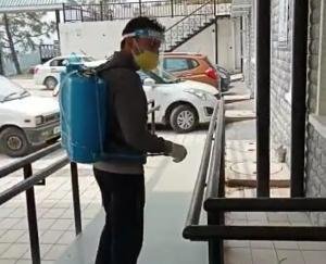 doctor sanitizing hospital