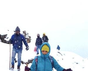 Tourists coming back during the snowfall in Triund.