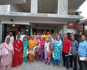 Name plaque and flags put up under Mahajan Sampark Abhiyan