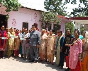 Ten-ten checks are being given to women's boards from MLA's pension