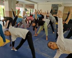Officers and employees working to make the 8th International Yoga Day a success