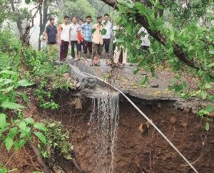 Kangra: Rain water washed away the road leading to Harijan Basti in Nandrul village