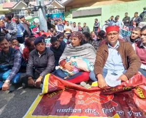 Woman fired from job sitting on strike with two month old baby