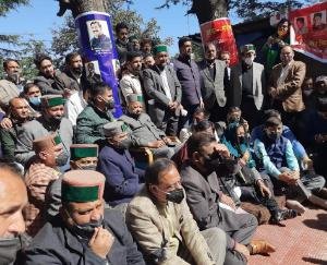 Former Chief Minister Virbhadra Singh sitting on silence outside the House